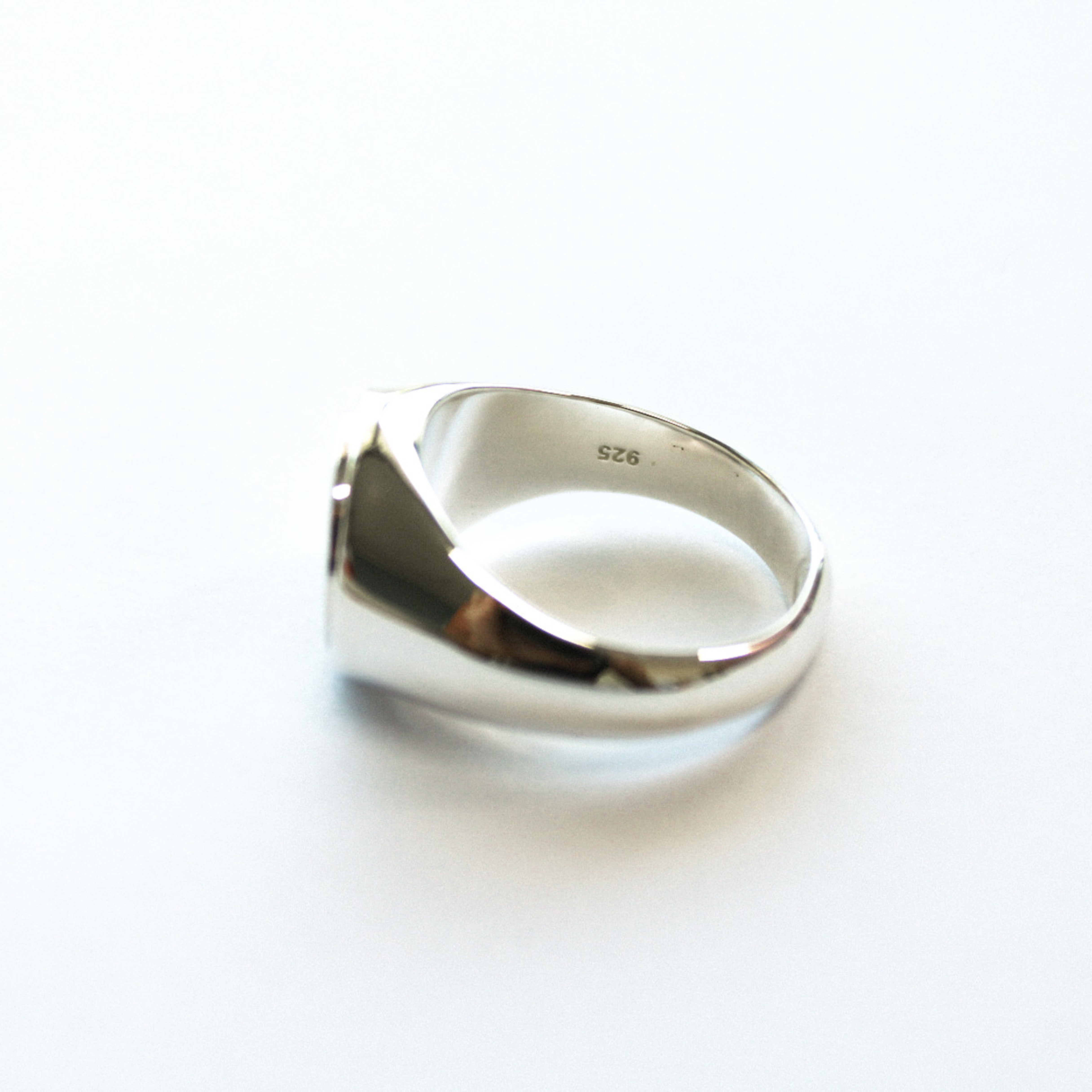 a side angle shot of The Kai ring from Star & co anxiety jewellery