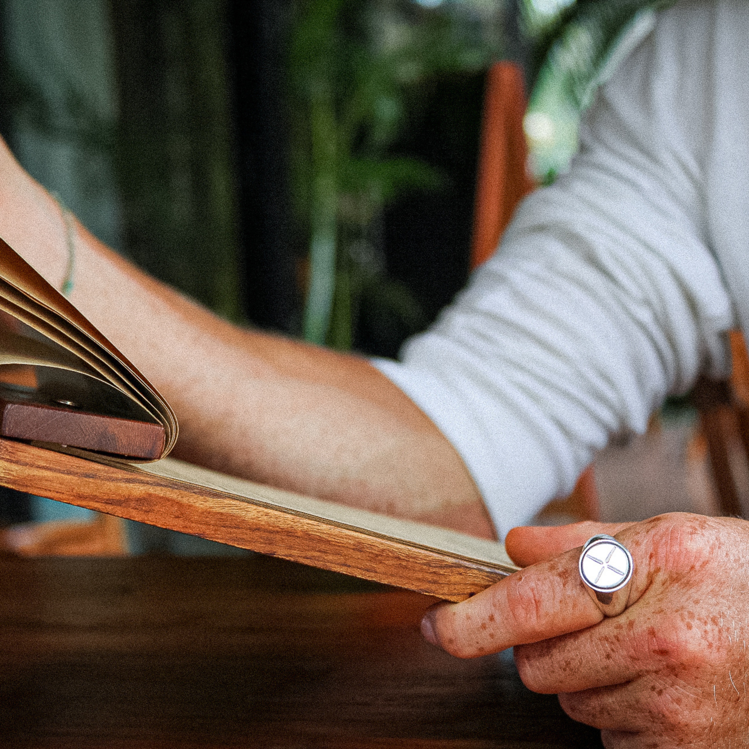 a man with a white shirt wearing the kai ring from star & co anxiety jewellery