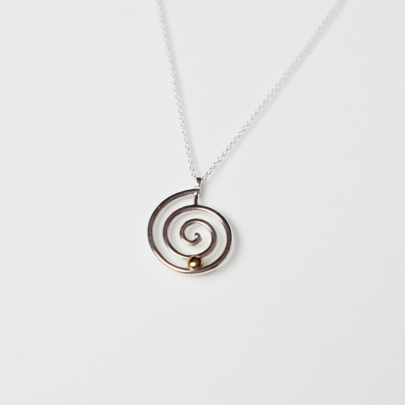 The Kirstie necklace anxiety necklace with silver spiral and bronze ball on white background